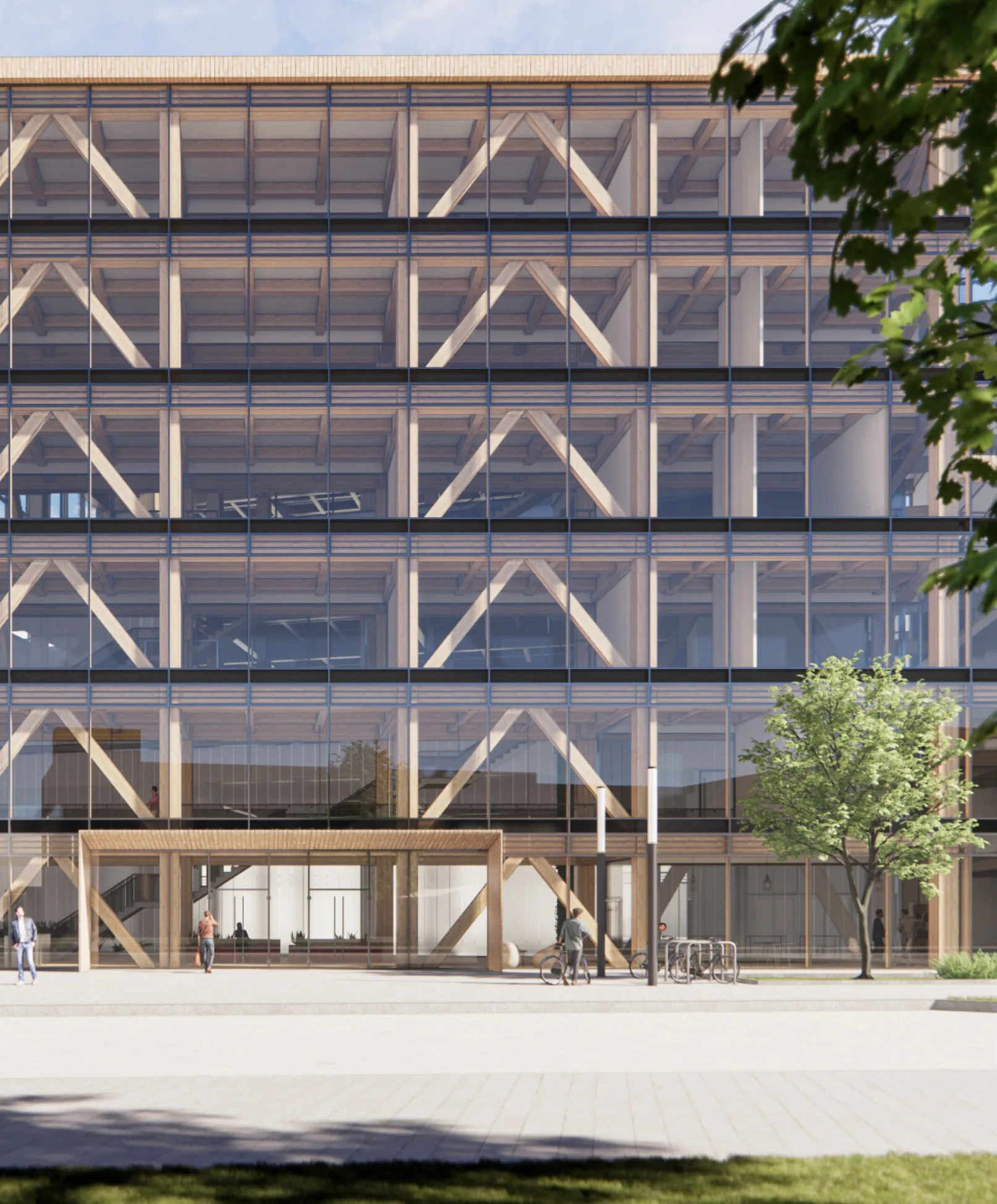 Haupteingang mit Holzstruktur hinter der Glasfassade